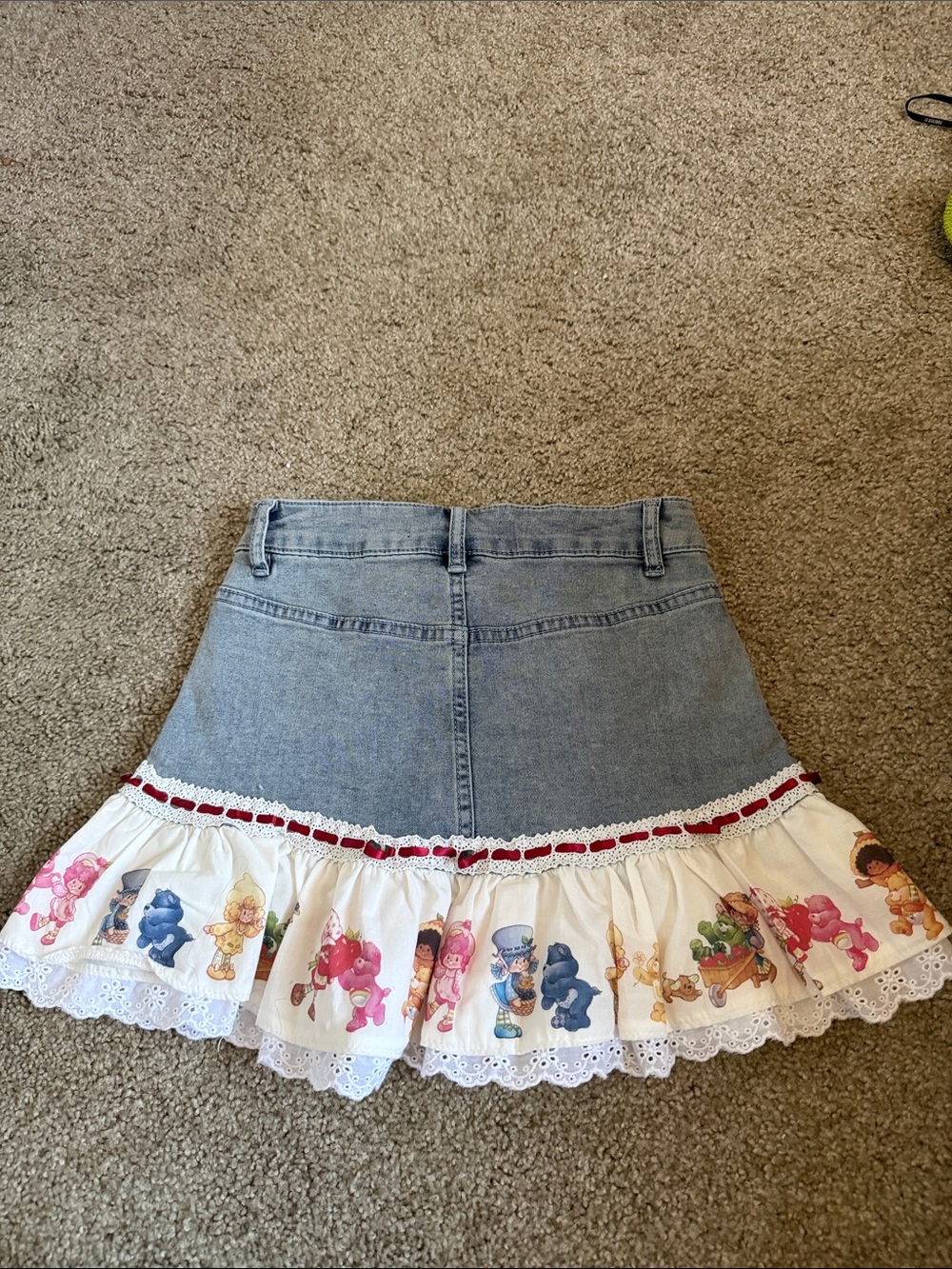Dolls Kill Blue Denim Mini Skirt with White Ruffle and Multicolor Print - Picture 2 of 3